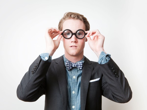 Studio shot of young man wearing funny glasses. Photo : Jessica Peterson