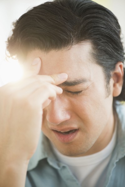 Man with headache.
