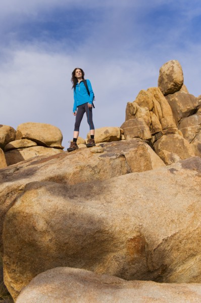 USA, California, Joshua Tree National Park, Female hiker on rocks.