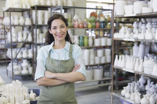 Woman in pottery warehouse.