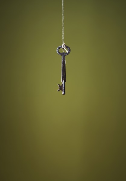 Key hanging on string.