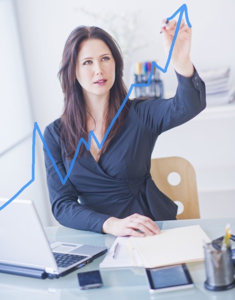Businesswoman drawing graph. 
Photo : Daniel Grill