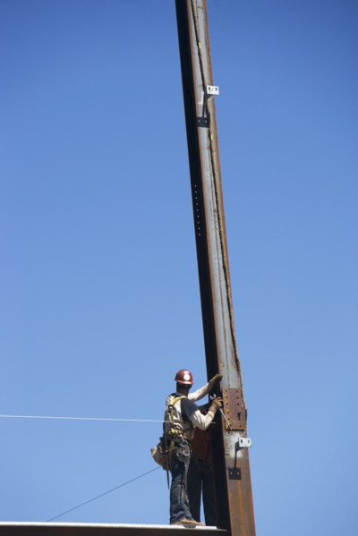 Construction workers on construction frame. 
Photo : fotog
