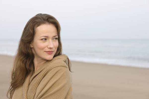 Young woman on empty beach. 
Photo : Jan Scherders