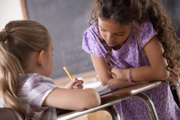 Schoolgirls in classroom. 
Photo : Rob Lewine