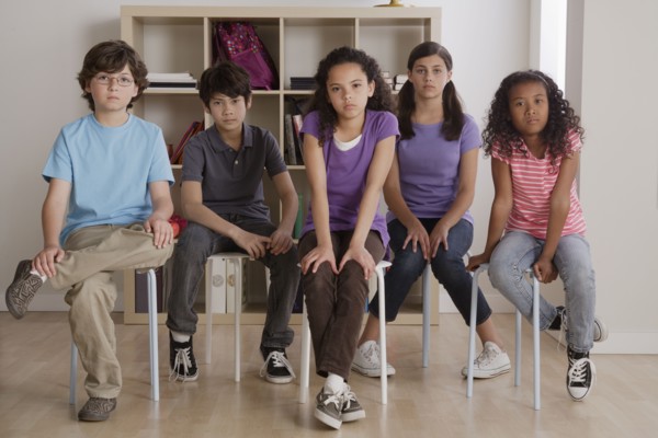 Portrait of serious pupils sitting in classroom. 
Photo : Rob Lewine