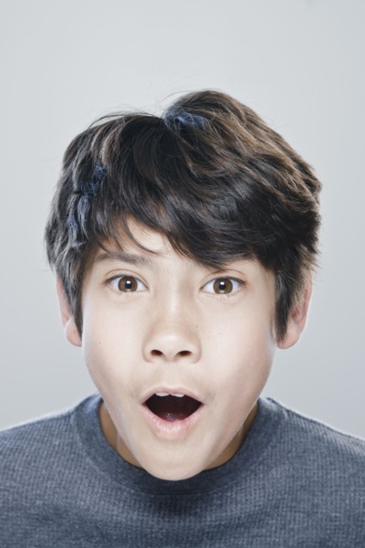 Portrait of boy (12-13) expressing surprise. 
Photo: Rob Lewine