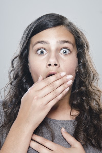 Portrait of girl (12-13) expressing fear. 
Photo: Rob Lewine