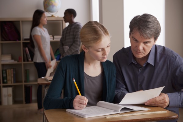 Teacher with teenage students (14-15) at school. 
Photo : Rob Lewine