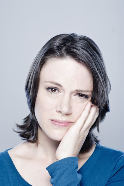 Portrait of worried mid adult woman, studio shot. 
Photo: Rob Lewine