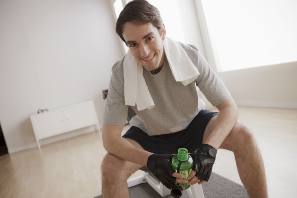 Young man exercising with dumbbell. 
Photo : Rob Lewine
