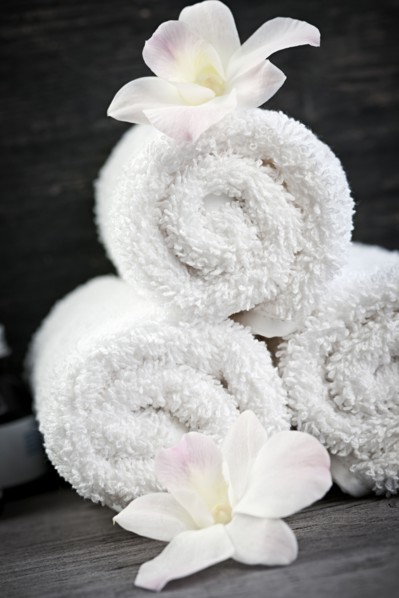 Still life with flowers and towels. 
Photo : Elena Elisseeva