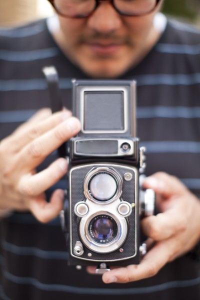 USA, New York State, New York City, Man holding old fashion camera. 
Photo: Jessica Peterson