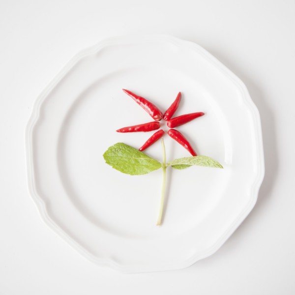 Flower on plate made out of food, studio shot. 
Photo: Jessica Peterson