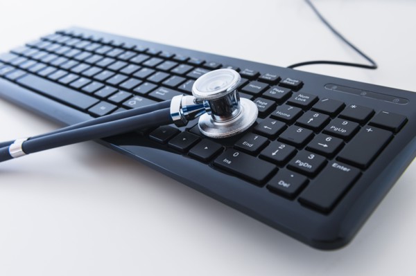 Stethoscope on computer keyboard.