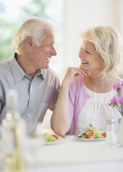 Couple enjoying healthy meal in restaurant.