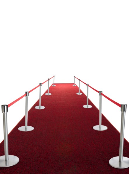 Studio shot of red carpet with stanchions and velvet rope.