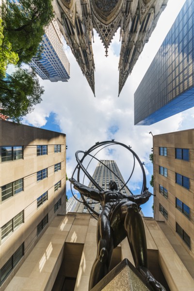 USA, New York City, Low angle view of statue outside Rockefeller Center.
