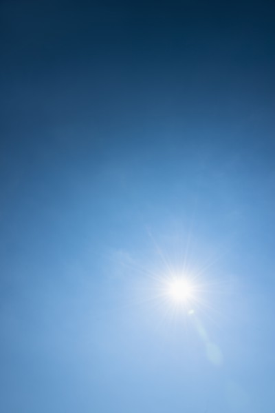 Clear blue sky and solar flare.