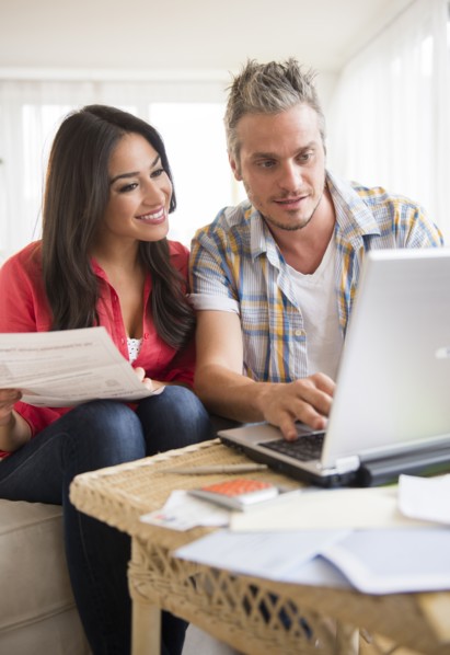 Couple paying bills. Photo: Jamie Grill