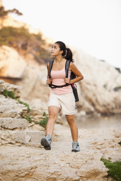 France, Marseille, Woman hiking in rocky terrain. Photo: Mike Kemp