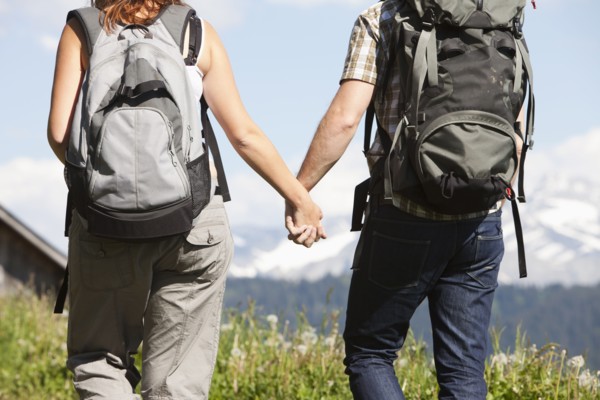 Switzerland, Leysin, Hikers walking and holding hands. Photo: Mike Kemp
