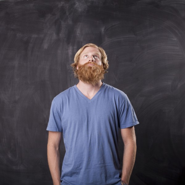 Man in front of blackboard. Photo: Jessica Peterson