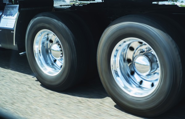 Wheels of truck in motion.