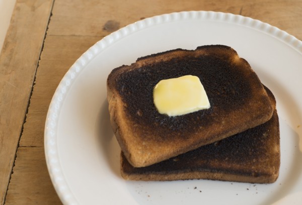 Burnt toasts on plate.