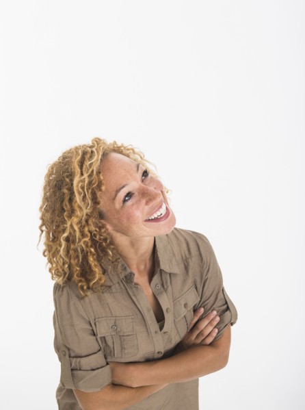 Portrait of young woman on white background, studio shot.
