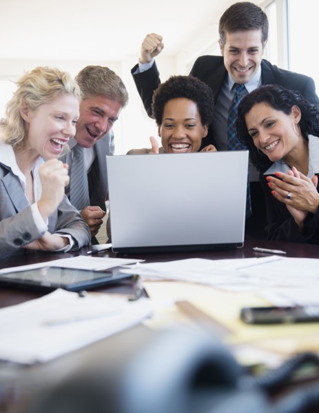 Office workers celebrating success. Photo : Jamie Grill