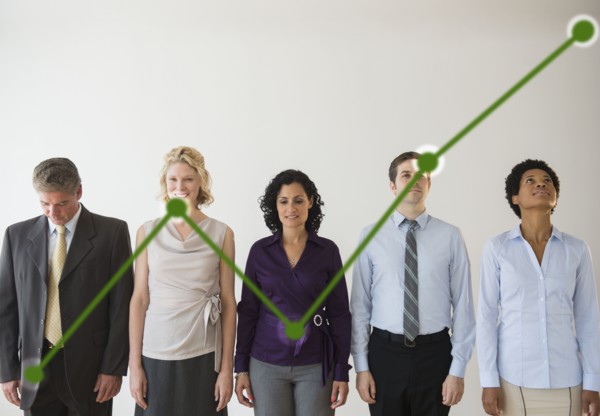 Office workers and green graph. Photo : Jamie Grill