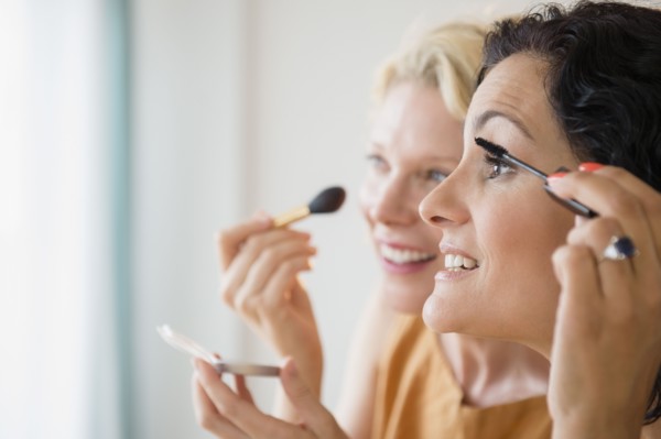 Female friends during applying make-up. Photo: Jamie Grill