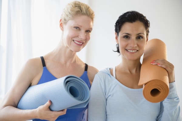 Female friends prepared for yoga class. Photo: Jamie Grill
