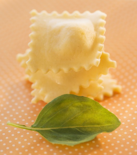 Studio Shot of ravioli and basil leaf. Photo: Daniel Grill