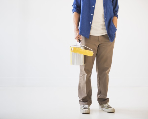 Man holding painting roll. Photo: Daniel Grill