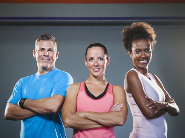 Portrait of three people with crossed arms.