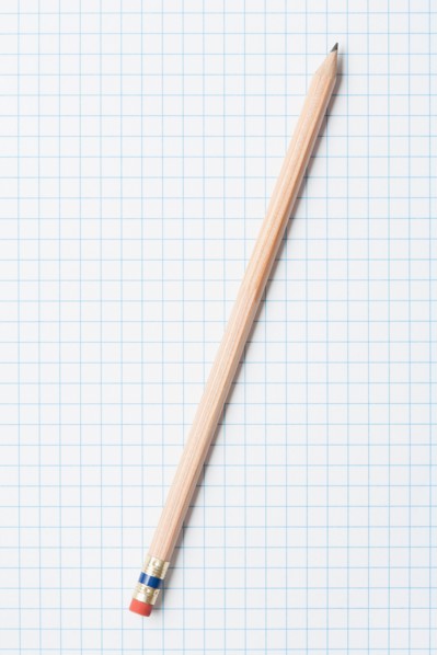 Single wooden sharpened pencil on graph paper. Photo : Kristin Duvall
