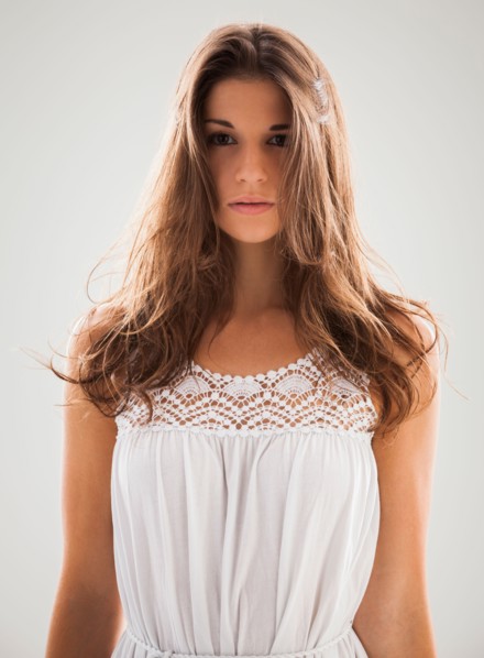Beautiful woman staring into camera. Photo : Mike Kemp