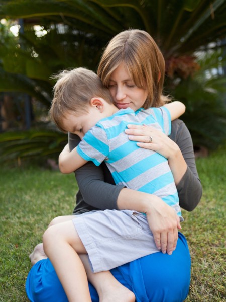 Mother hugging her son. Photo : Jessica Peterson