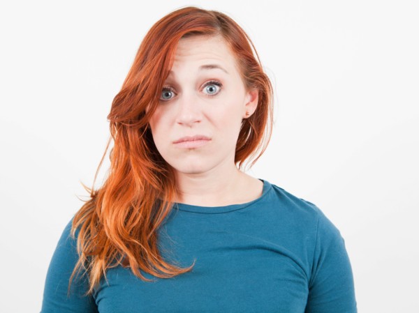 Studio Shot, Portrait of woman grimacing. Photo: Jessica Peterson