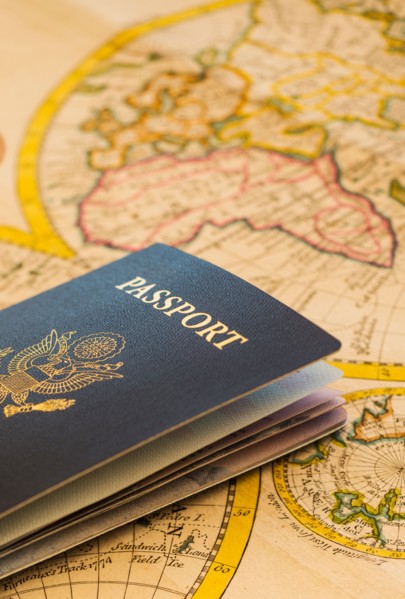 Passport sitting on antique map.