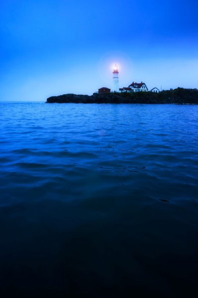 Remote coastline with lighthouse. Portland, Maine.