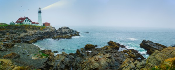 Remote coastline with lighthouse. Portland, Maine.