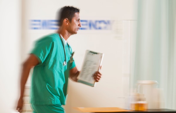 Surgeon entering emergency room.