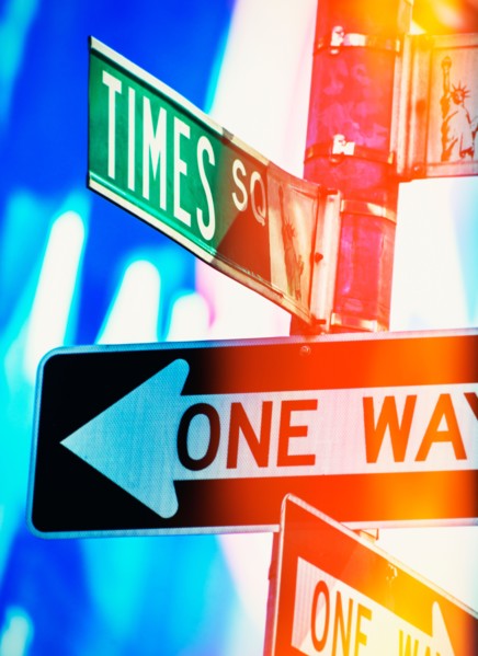 Directional signs at night. New York City, New York.