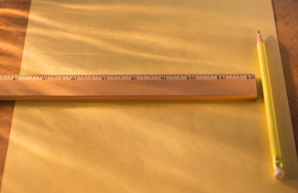 Elevated view of ruler, pencil and paper sheet