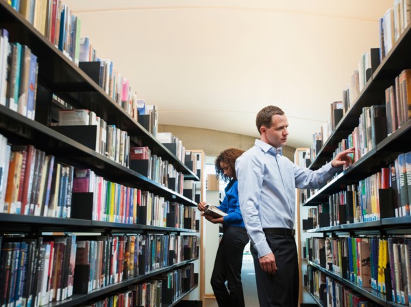 View of man and woman researching library