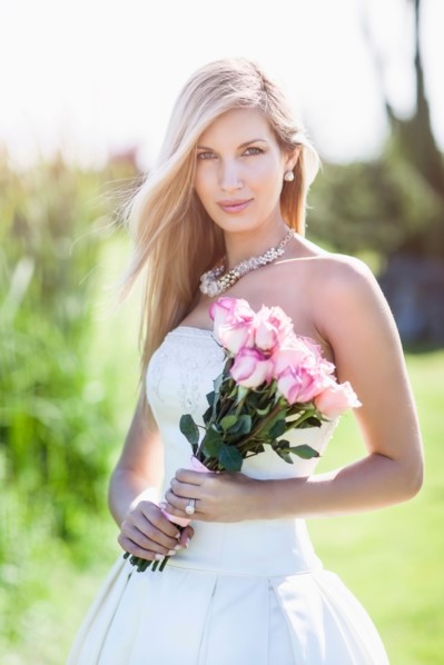 Portrait of bride holding bouquet