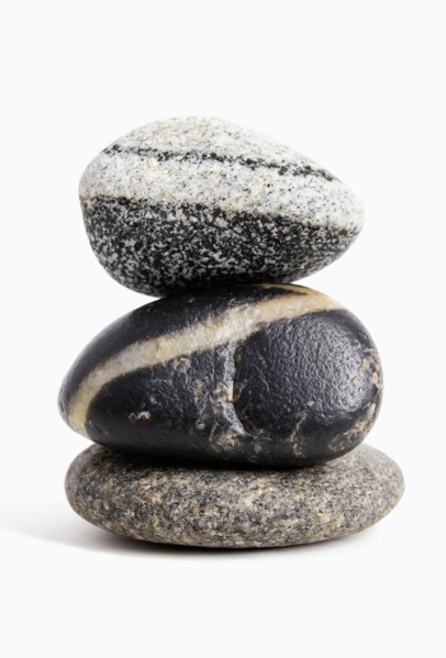 Studio shot of stack of three stones white background